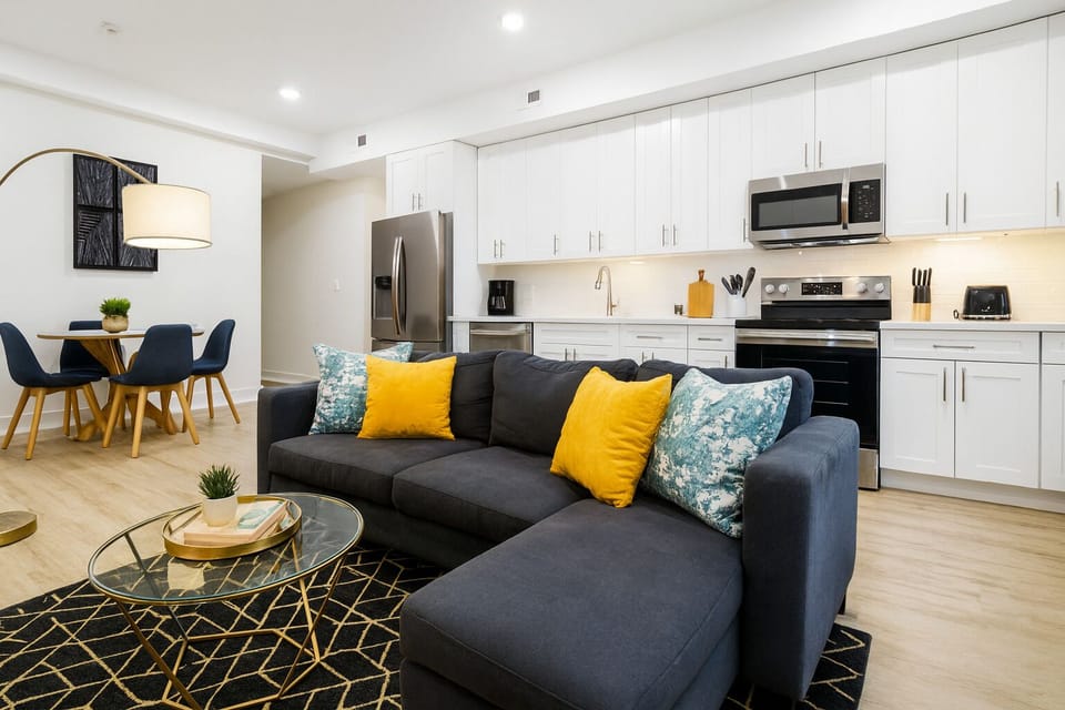 Modern living room with a comfy sofa and smart TV for movie nights.