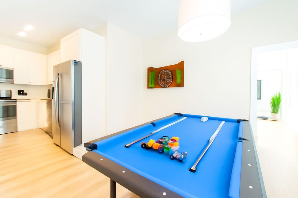 Game on! Enjoy a friendly match on the sleek pool table perfect for fun nights in