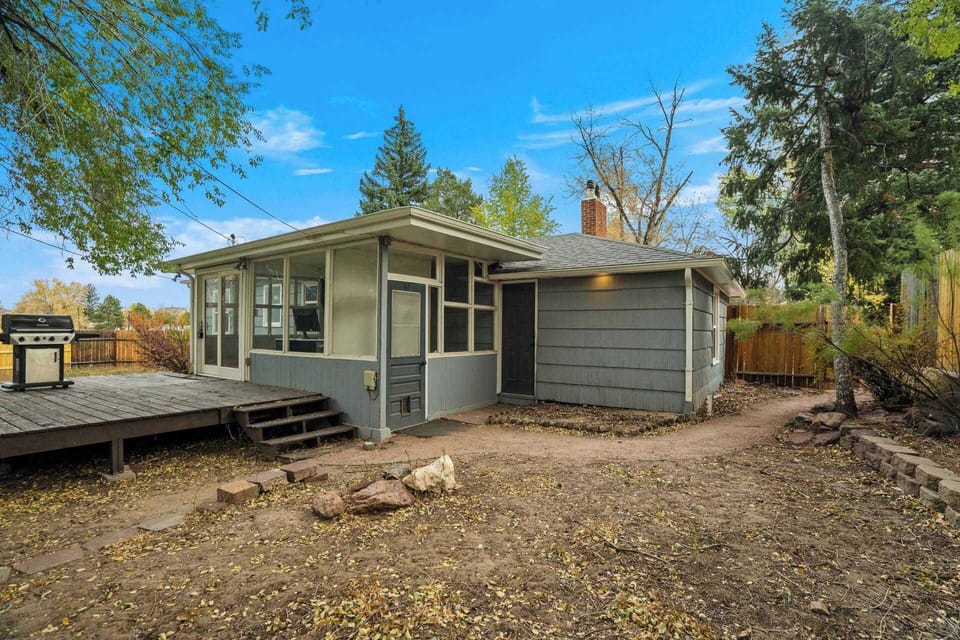Spend time outdoors on the wooden deck, surrounded by trees and a spacious yard for fresh-air downtime.