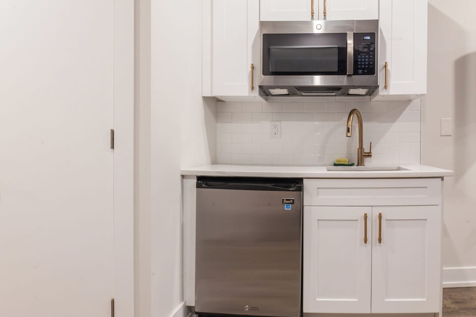 Cook up a storm in our fully-equipped kitchen with state-of-the-art appliances and sleek countertops. #CookingGoals #KitchenEssentials 