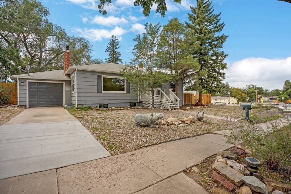 Pull into the wide driveway and enjoy the quiet, tree-lined setting—an easy home base to come back to after exploring.