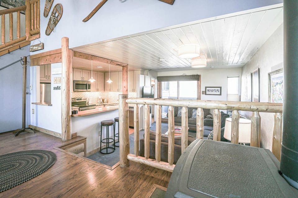 wooden railings overlooking a lower living area