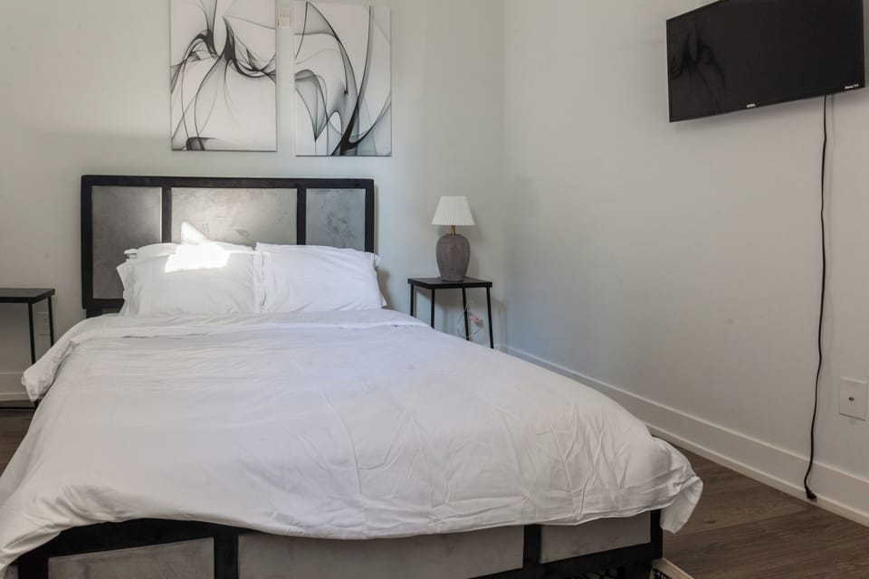 Experience a stay filled with personalized touches in our thoughtfully designed bedroom. Every detail, from the artwork to the decor, contributes to a uniquely welcoming atmosphere