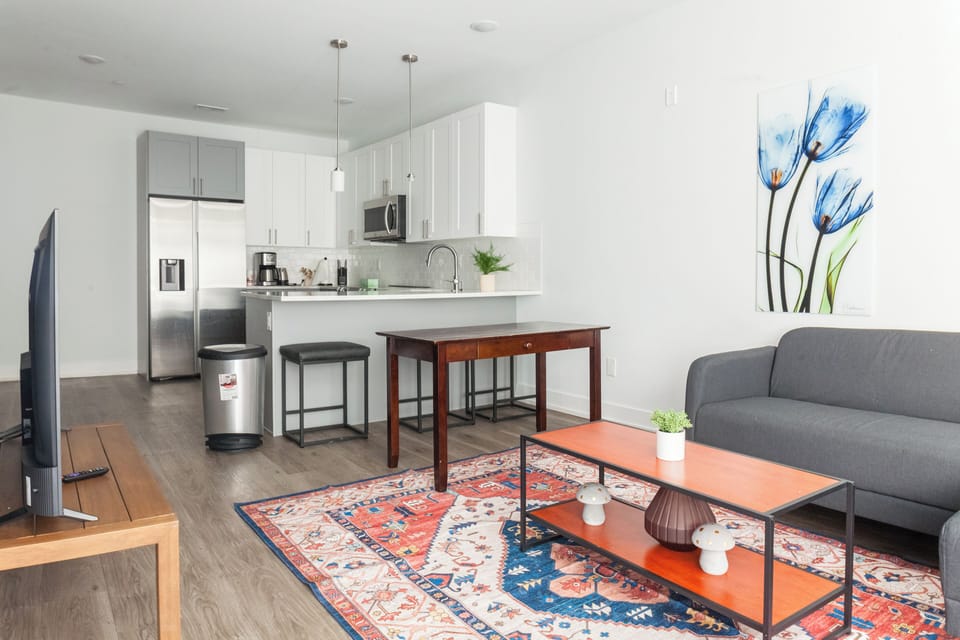 Relax in style in our chic living room adorned with modern furnishings and plenty of natural light