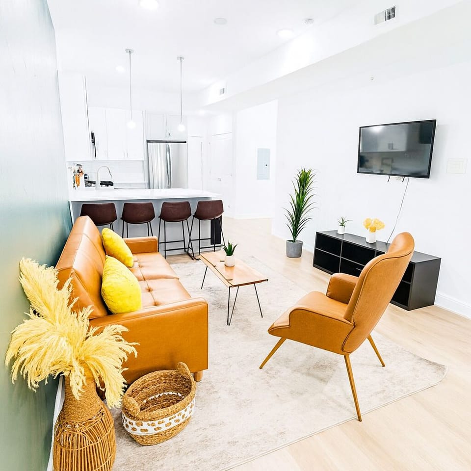 Stylishly furnished with a plush sofa, smart TV, and modern décor for ultimate relaxation.