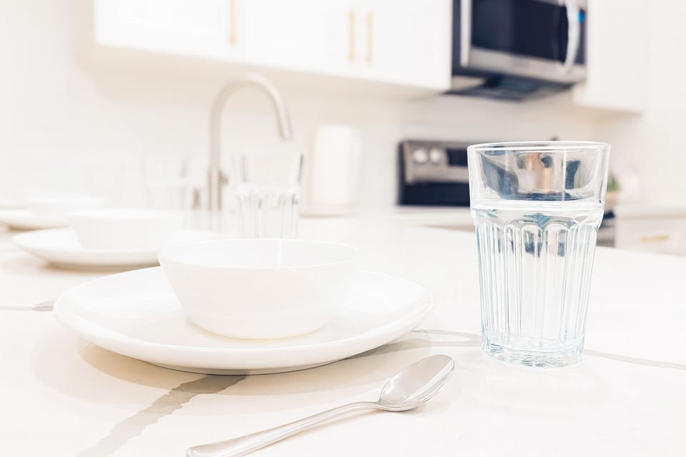 Stocked with essential cookware, utensils, and dining ware.
