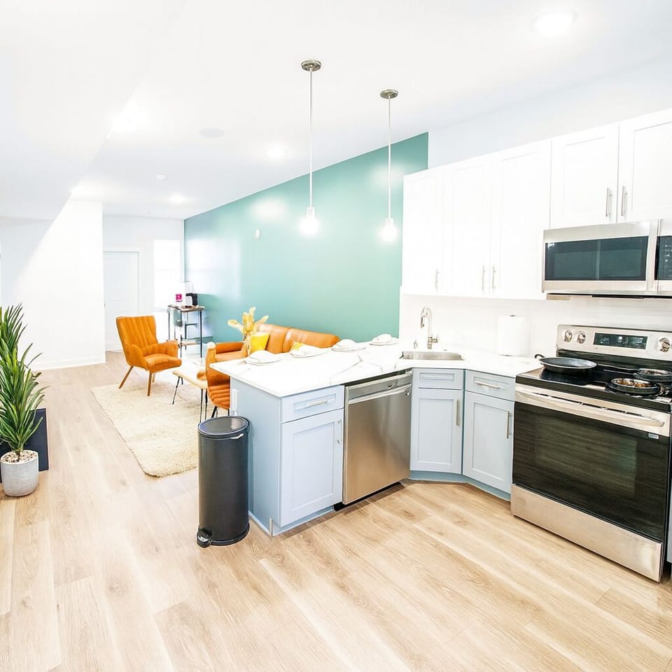 Modern lighting and organized storage for a clean, airy vibe.