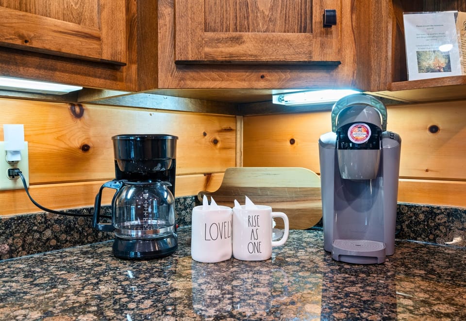 Coffee station complete with drip and Keurig brewers for morning convenience.