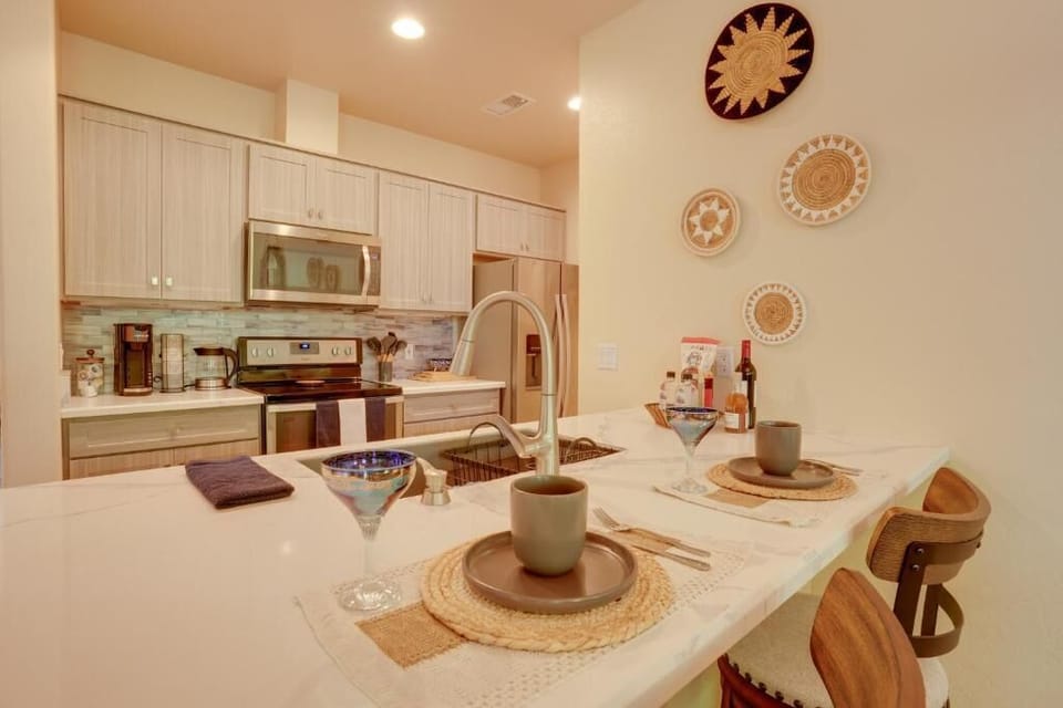 Kitchen and breakfast island with stools. 