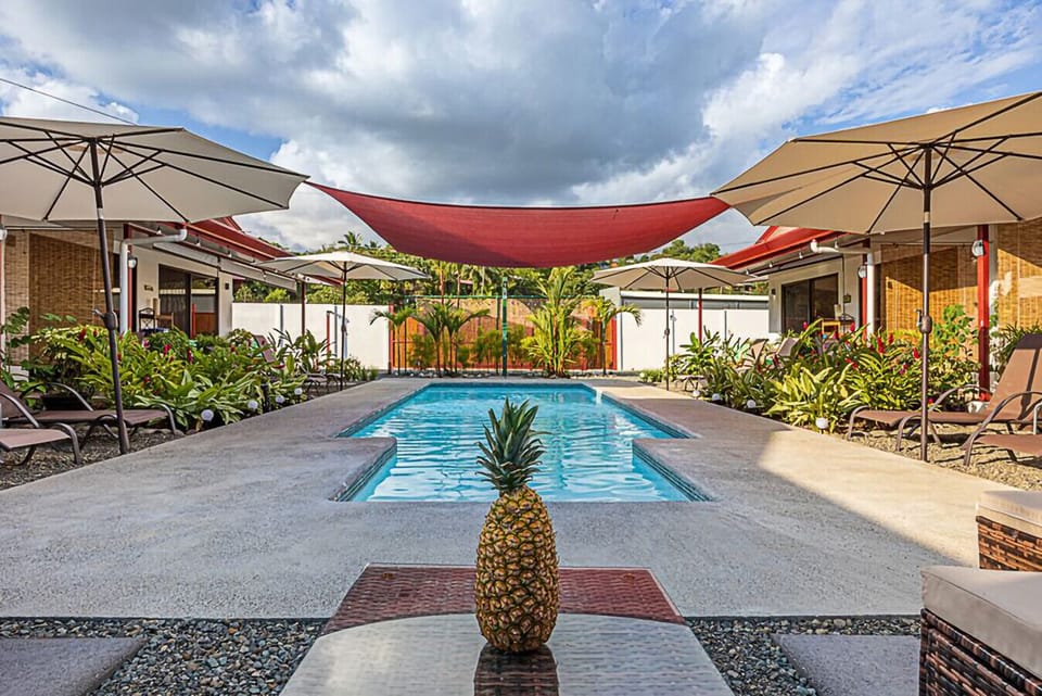Perfect for families—our pool area offers shaded seating, loungers, and tropical landscaping.