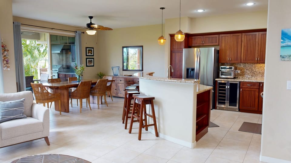 Open concept kitchen and dining area with island seating