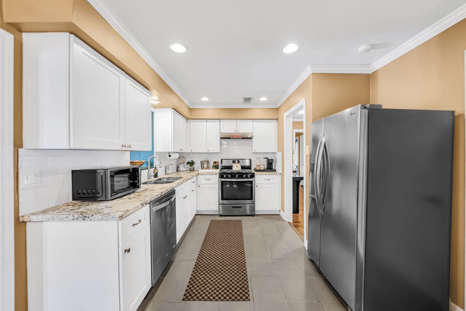 Bright, inviting kitchen with spacious counters and everything you need to cook.