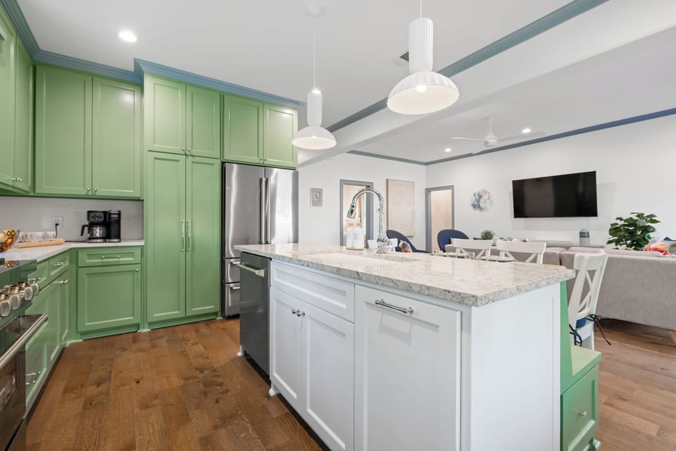 Full kitchen with all appliances and open to living room with smart TV and Sonos