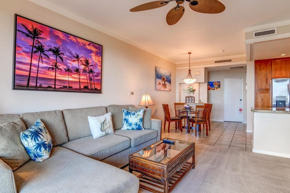     Spacious tropical condo with sunset art, island decor, and dining. KGV-22T5