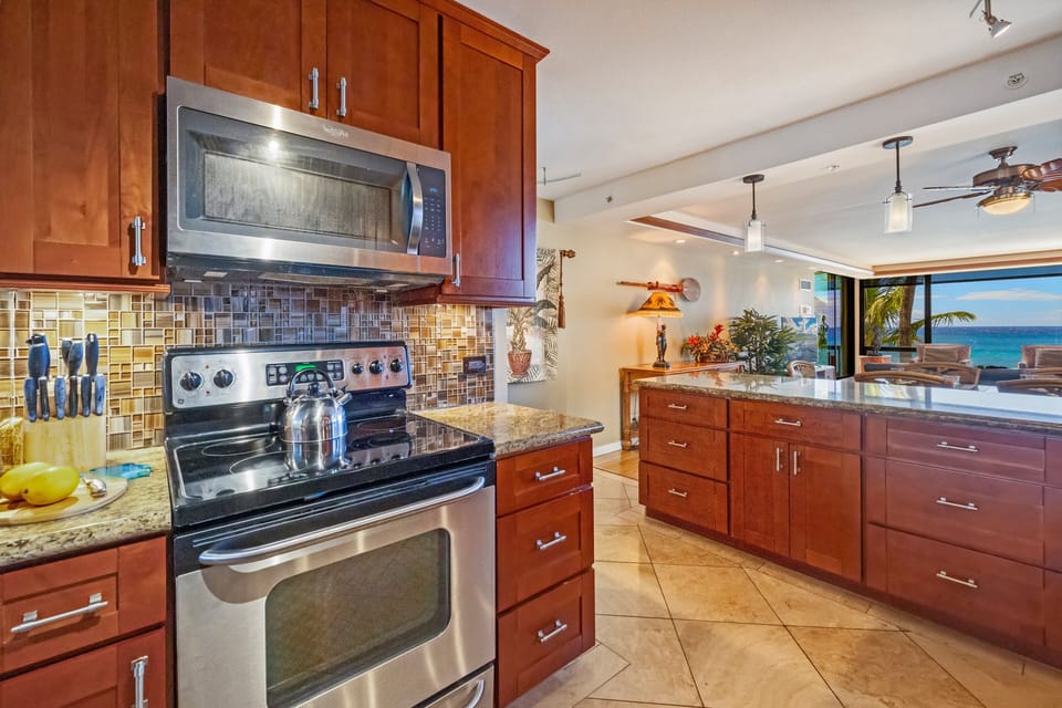 Open-plan kitchen and dining space with modern finishes and ample lighting.