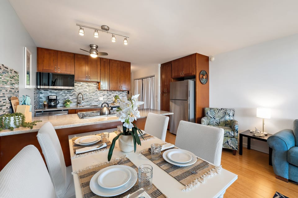 Inviting dining area perfect for shared meals, with open access to a well-appointed kitchen and bar seating.