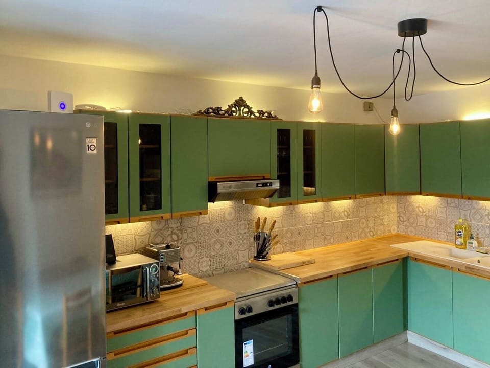 The modern, family kitchen is well-equipped with plenty of space.