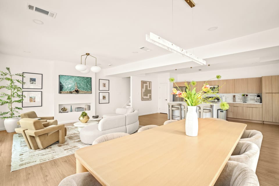 Bright open-concept living and dining area with modern decor and cozy seating.