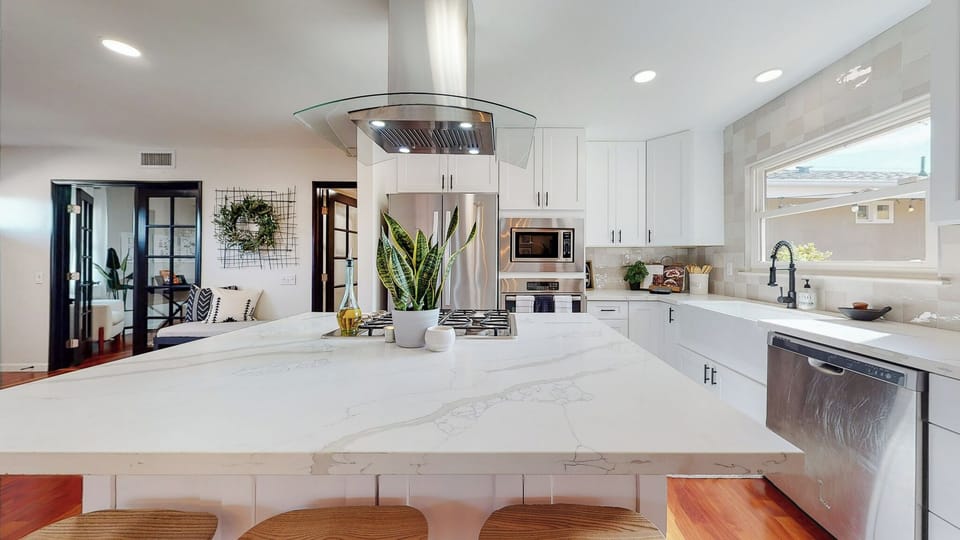 Spacious kitchen with modern appliances for culinary convenience.