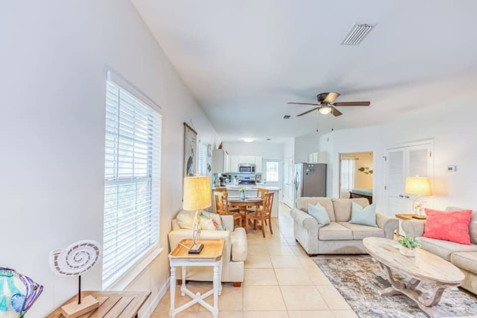 Living Room: Bright and inviting space to relax or entertain, complete with stylish furniture and natural light!