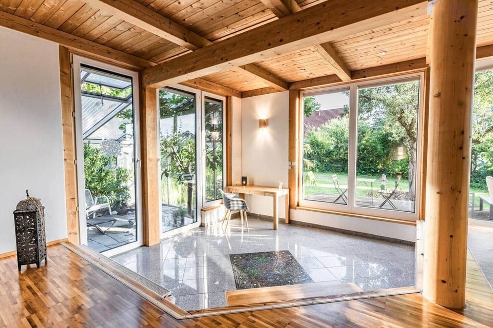 open floor plan with step to the work area and access to the conservatory
