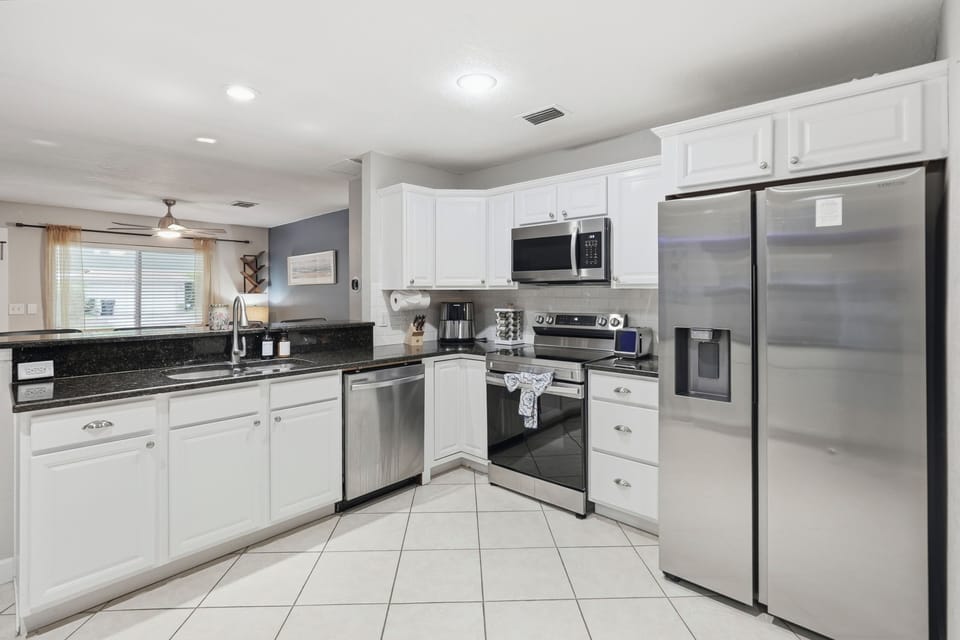 Enjoy a bright, spacious kitchen with ample countertops for cooking, serving, or gathering with family and friends.