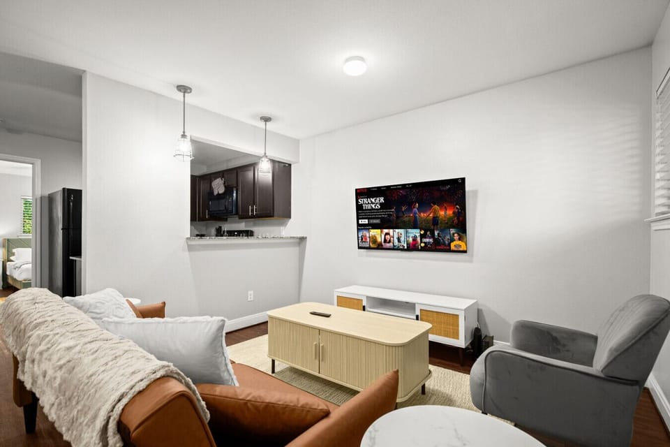 Comfortable living room setup with sofa bed and lounge seating
