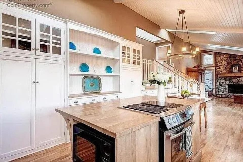This is the social heart of the home. Our open-concept gourmet kitchen is designed for connection, featuring a massive central island with a built-in cooktop.

Prepare a beautiful meal while friends and family gather around, or set out drinks and app