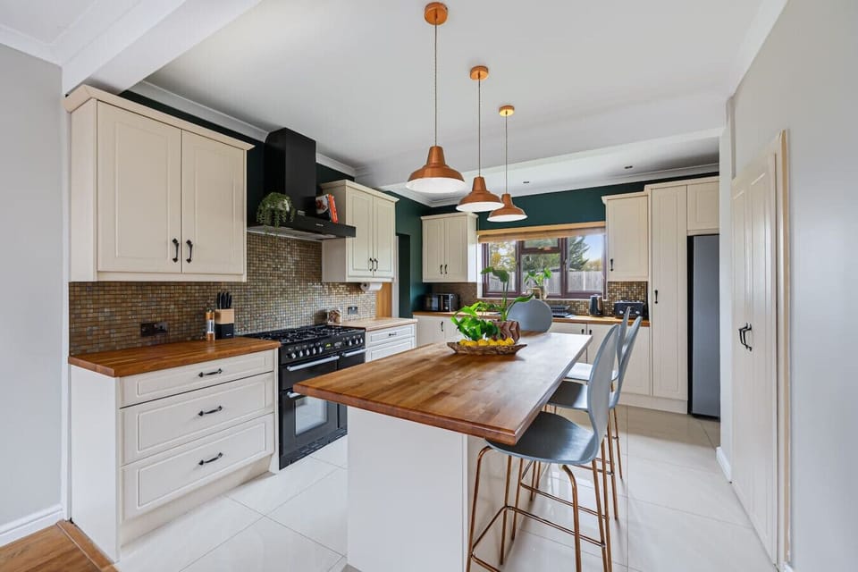 The modern kitchen comes fully equipped with quality appliances and all the essentials for home cooking.