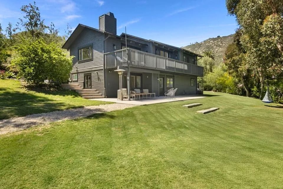 View of the home from the expansive front yard. Fully-fenced!