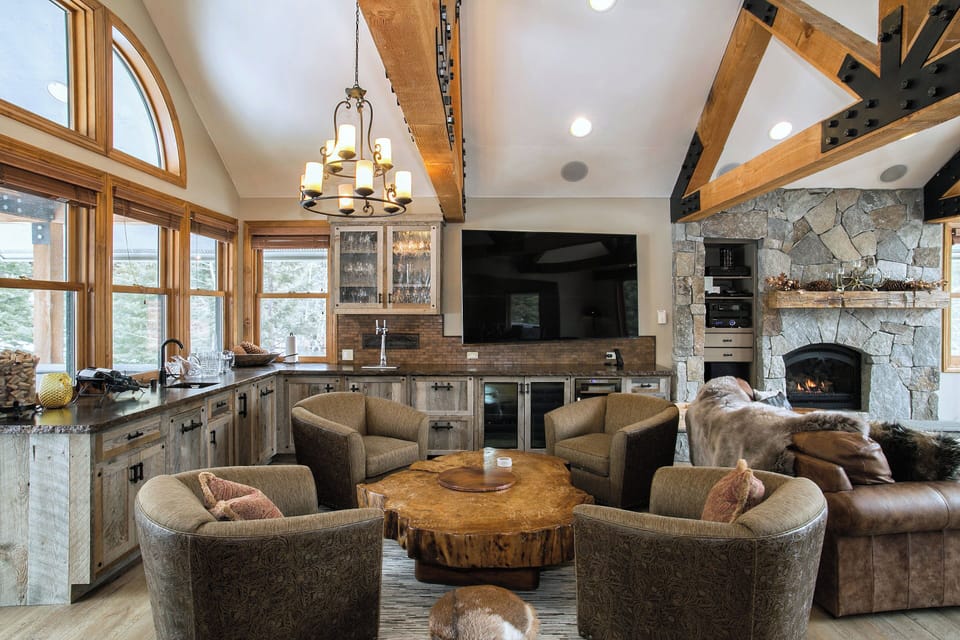 Relax next to the wet bar w/ forest views