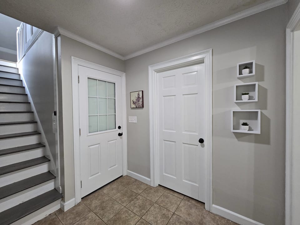 Downstairs bathroom/laundry room and garage door