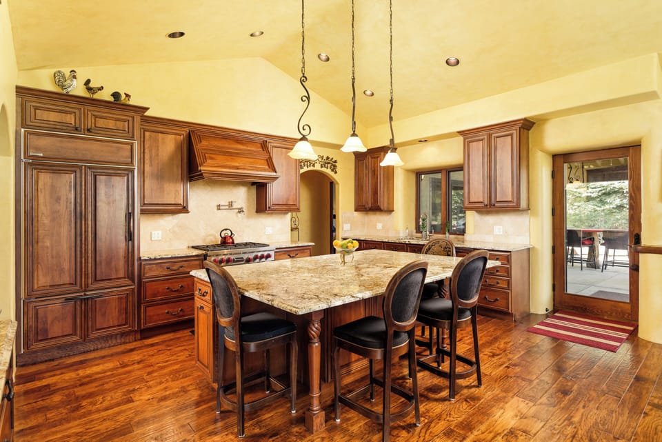 Gorgeous chef's kitchen with ample space. Gas range, built in fridge, and room to spread out and cook.