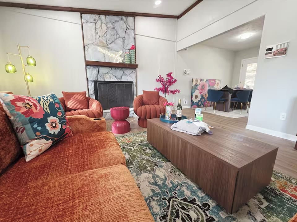 Cozy, stylish living room with plush seating and vibrant accents.