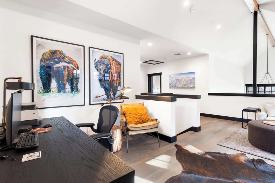Upstairs loft area: Sectional sofa, Smart TV, desk workspace