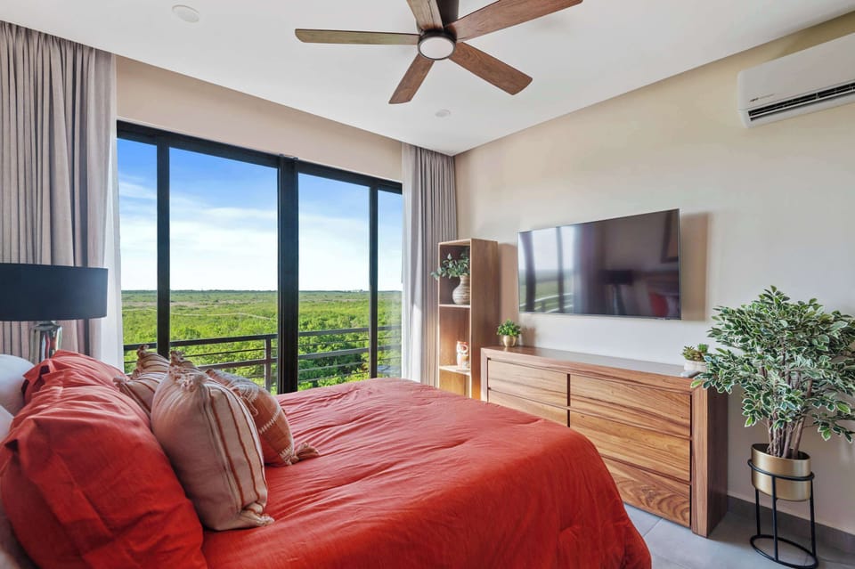 Bedroom with king-size bed, views, and private bathroom