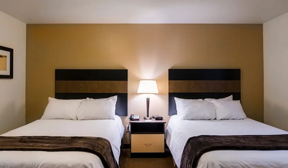 Settle in together with two plush beds and soft lighting.