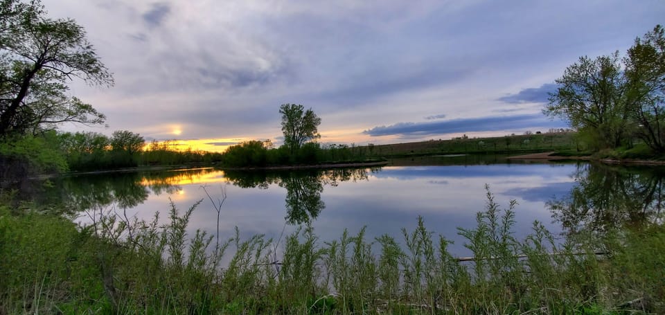 Soak in peaceful sunset reflections on a nearby lake.