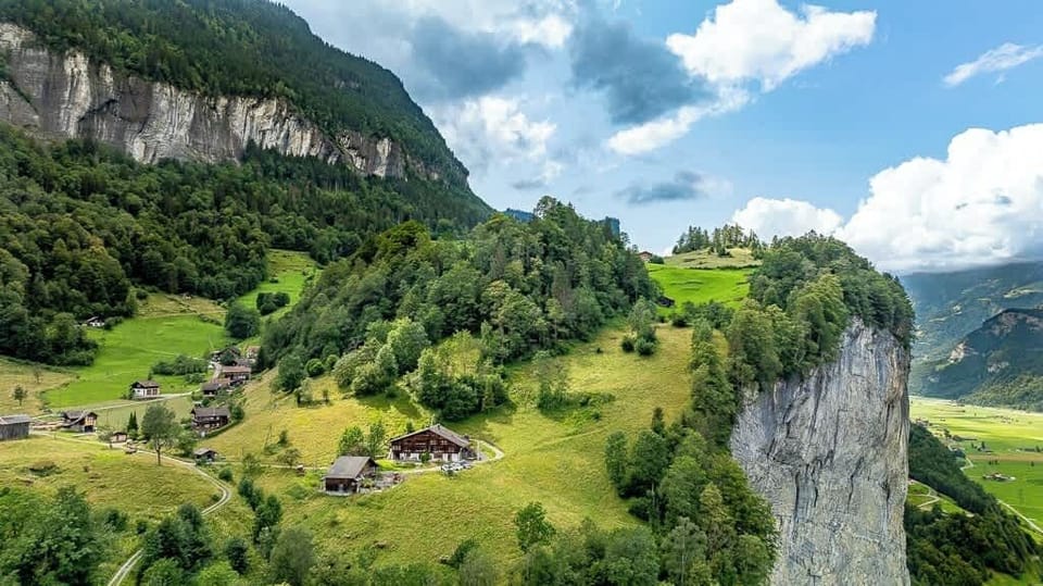 Wide valley view across the Haslital landscape
