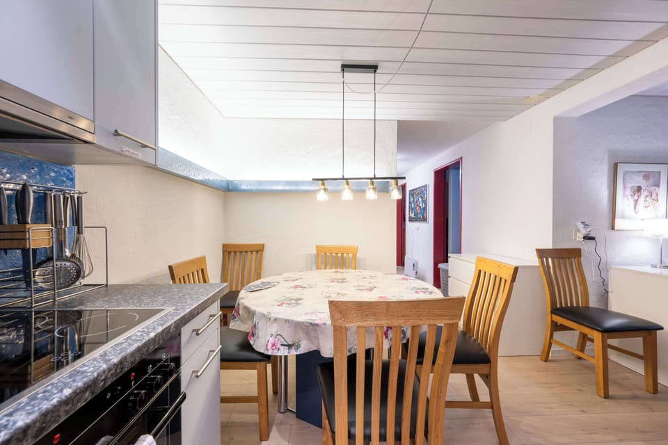 Open kitchen and dining area for shared meals
