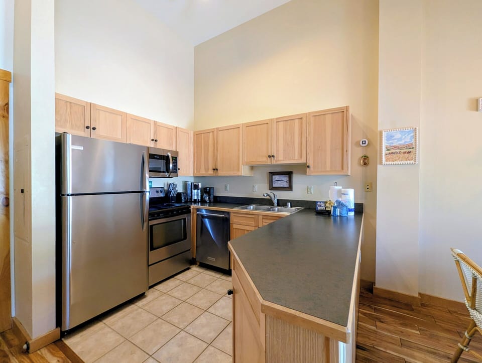 Your fully equipped kitchen makes meal prep easy with modern stainless appliances and plenty of counter space for spreading out ingredients and enjoying casual breakfasts together.