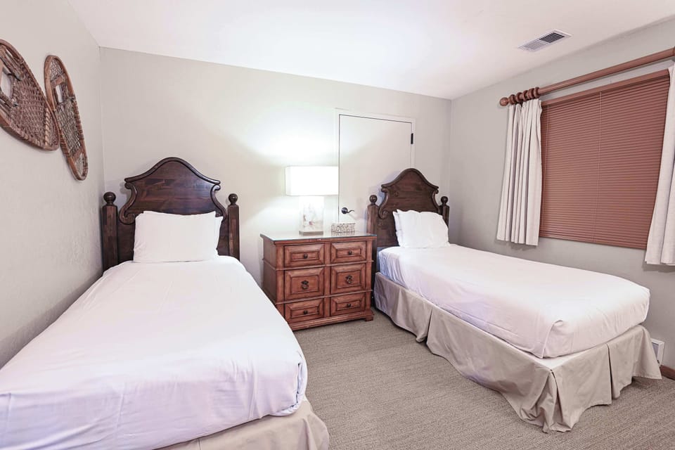 【Twin Room — Alt Angle】Twin beds from doorway — daylight + en-suite access | Listed with @BookTraverse