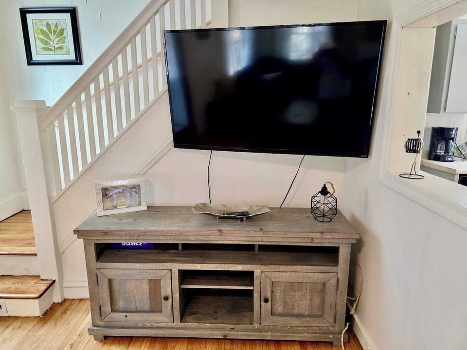 Smart TV and cozy seating for entertainment nights.