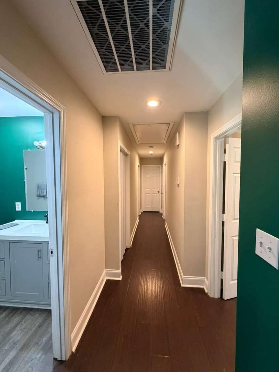 A clean, well-lit corridor designed for easy navigation, offering a simple and inviting transition between living spaces.