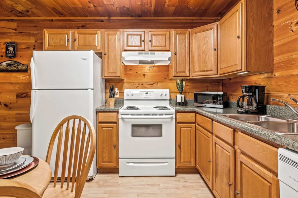 Fully stocked kitchen & cozy dining for four with washer/dryer access.