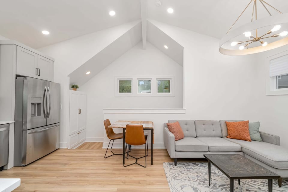 Bright and airy open concept living room, kitchen, and dining area