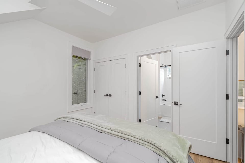 Peaceful bedroom with queen bed and ensuite bath