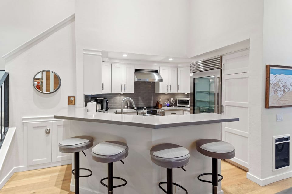 Gourmet kitchen with stainless steel appliances and stone counters!