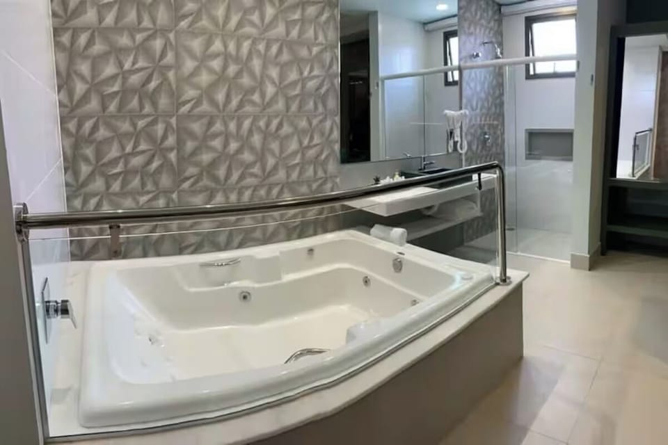 Indulge in a deep jetted bath for total relaxation.