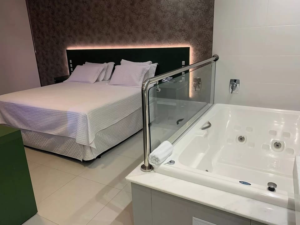 Soak in a private jetted tub steps from the bed.